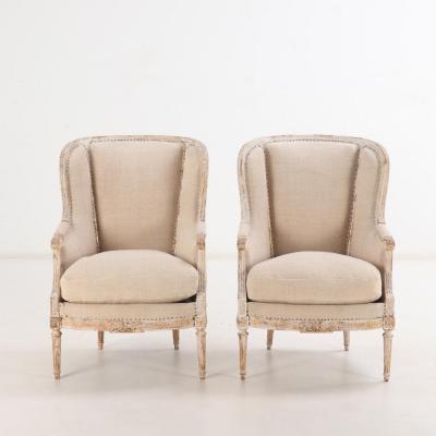 A Pair of French Louis XVI style upholstered and painted bergere chairs C 1900 