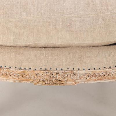 A Pair of French Louis XVI style upholstered and painted bergere chairs C 1900 