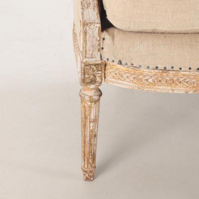 A Pair of French Louis XVI style upholstered and painted bergere chairs C 1900 