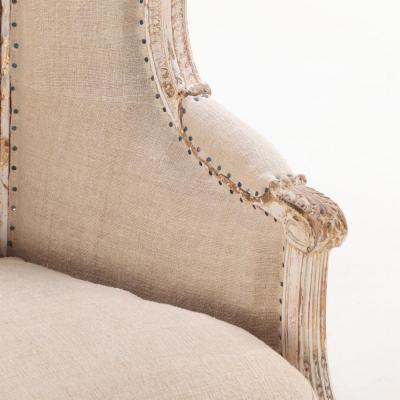 A Pair of French Louis XVI style upholstered and painted bergere chairs C 1900 