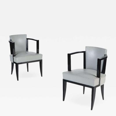 A Pair of French ebonized open armchairs with faux leather upholstery C 1940