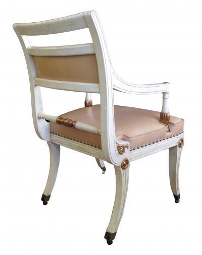 A Pair of Hollywood Regency Ivory Painted and Parcel Gilt Klismos Armchairs