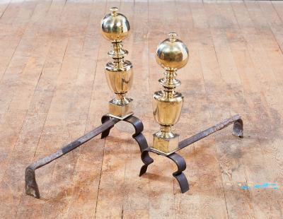 A Pair of Italian Baroque Brass and Iron Andirons