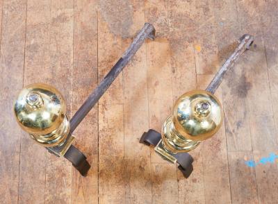 A Pair of Italian Baroque Brass and Iron Andirons