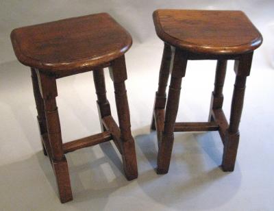 A Pair of Oak Choir or Joint Stools with Shaped Tops and Columnar Legs