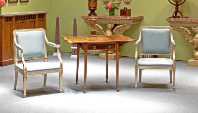 A Pair of Painted and Parcel Gilt Armchairs