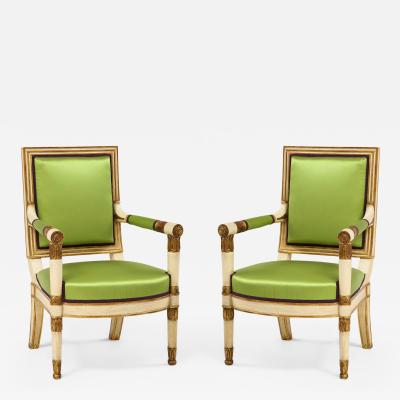 A Pair of Painted and Parcel Gilt Empire Armchairs