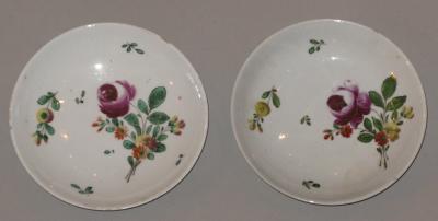 A Pair of Porcelain Saucers Painted with Floral Decoration