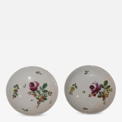 A Pair of Porcelain Saucers Painted with Floral Decoration