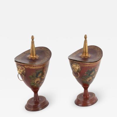 A Pair of Tole Peinte Lidded Chestnut Urns with Floral Stenciled Motifs