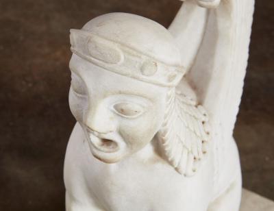 A Pair of White Marble Carved Sphinxes