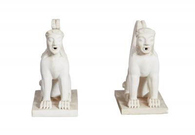 A Pair of White Marble Carved Sphinxes