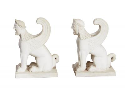 A Pair of White Marble Carved Sphinxes