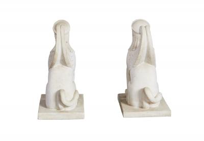A Pair of White Marble Carved Sphinxes