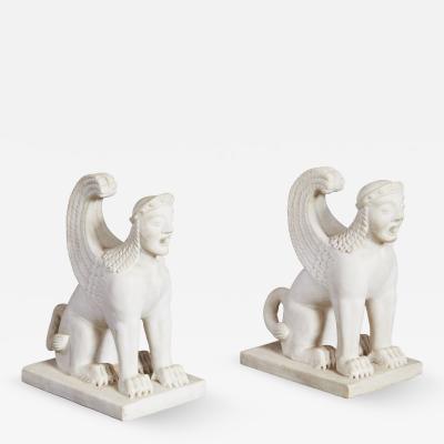 A Pair of White Marble Carved Sphinxes