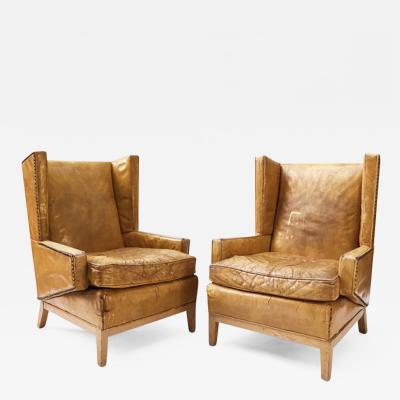 A Pair of Yellow Leather Arm Chairs