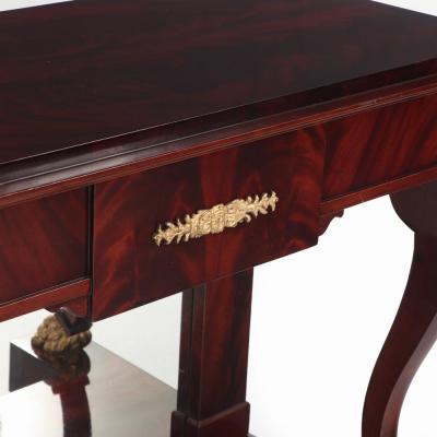 A Pair of custom Empire style crotch mahogany console tables 