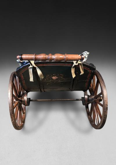 A Polychrome early 19th century child s three wheeled pushchair