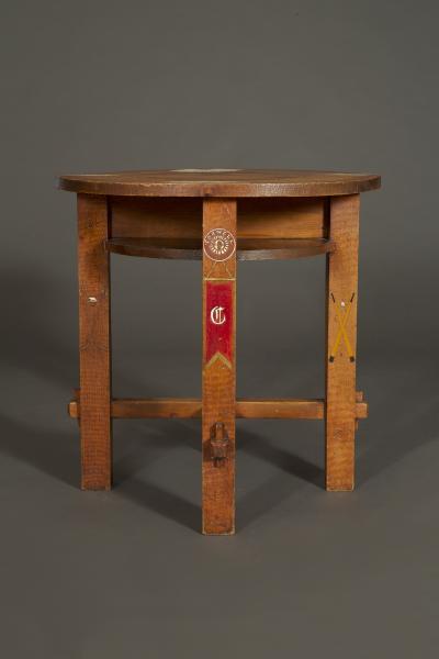 A Pyrographic Polychrome Games Table Decorated with Symbols Universities