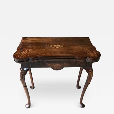 A Queen Anne Period Carved Walnut Lift top Gate Leg Games Card Table