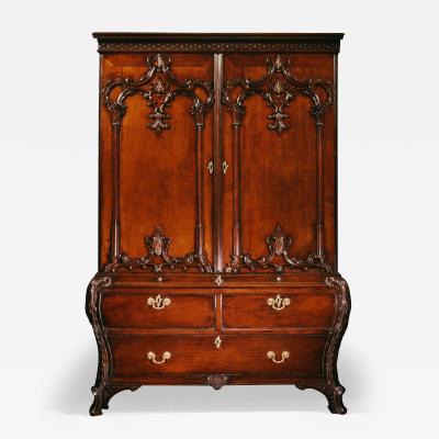 A RARE CARVED MAHOGANY BOMBE LINEN PRESS TO A DESIGN BY THOMAS CHIPPENDALE