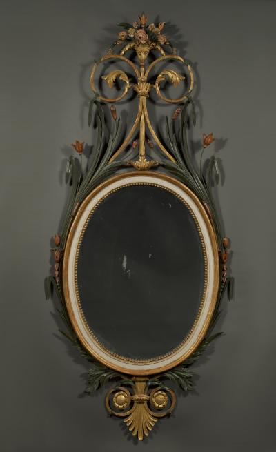 A RARE OVAL GILT WOOD AND PAINTED MIRROR OF LARGE SCALE