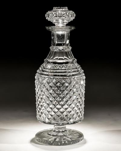 A RARE PEDESTAL FOOTED DIAMOND CUT DECANTER