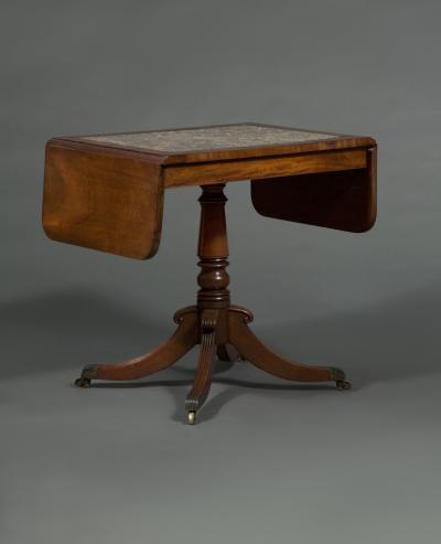 A REGENCY DROP LEAF CENTER TABLE WITH INSET DERBYSHIRE FOSSIL MARBLE TOP