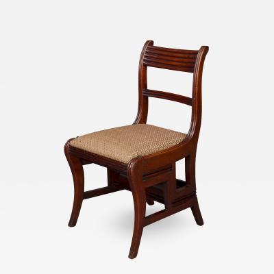 A REGENCY METAMORPHIC WALNUT SIDE CHAIR LIBRARY STEPS