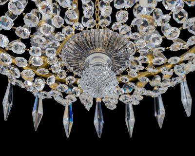 A REGENCY SIX LIGHT CRYSTAL CHANDELIER