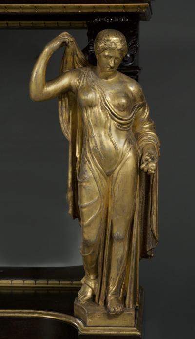 A REMARKABLE EBONIZED AND GILT SIDE TABLE