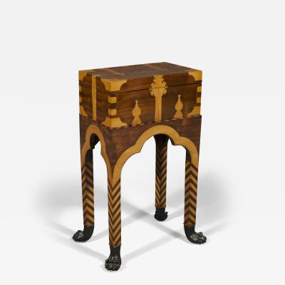 A REMARKABLE MAHOGANY AND BOXWOOD INLAID CASKET ON STAND