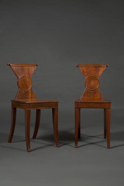 A Rare Pair of Regency Mahogany Hourglass Form Hall Chairs