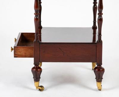 A Regency Four Tier Etagere with Rare Lotus Carved Legs