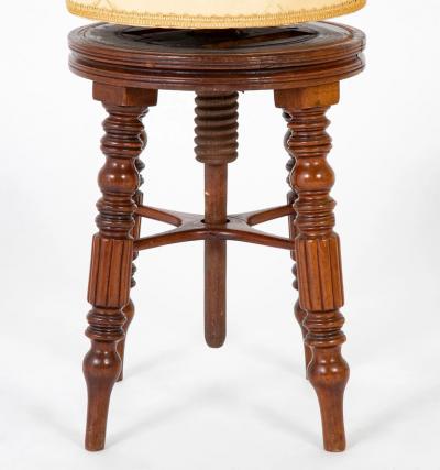 A Regency Reeded Leg Mahogany Revolving Stool