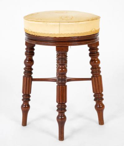A Regency Reeded Leg Mahogany Revolving Stool