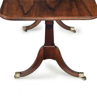 A Regency brass inlaid rosewood sofa table attributed to Gillows