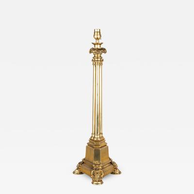 A Regency brass triple column table lamp