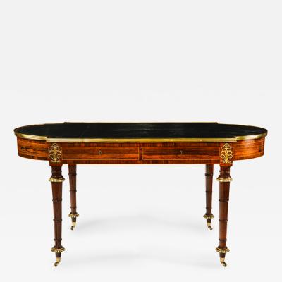 A Regency ormolu mounted rosewood two drawer writing table