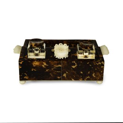 A Regency tortoiseshell and ivory desk set