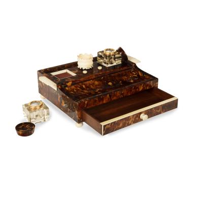 A Regency tortoiseshell and ivory desk set