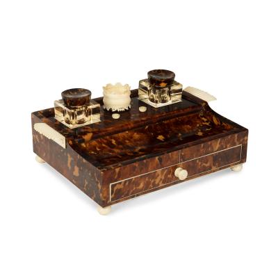 A Regency tortoiseshell and ivory desk set
