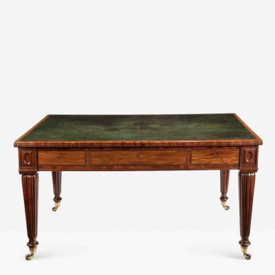 A Regency well figured mahogany writing table