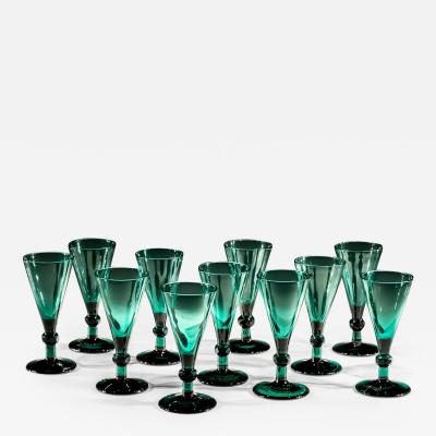 A SET OF ELEVEN GREEN WINE GLASSES