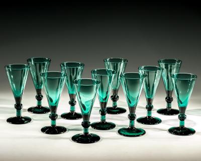 A SET OF ELEVEN GREEN WINE GLASSES