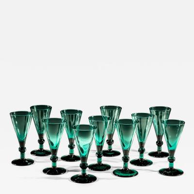 A SET OF ELEVEN GREEN WINE GLASSES
