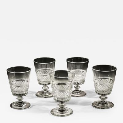 A SET OF FIVE REGENCY FINELY CUT GOBLETS