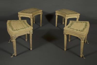 A SET OF FOUR LOUIS XVI PAINTED CHAISES DE JARDIN OF UNUSUAL CURVED FORM