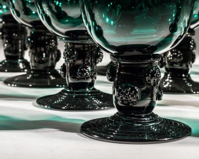 A SET OF SIXTEEN BRISTOL GREEN ROEMERS