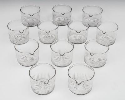 A SET OF TWELVE FLUTE CUT FINGER BOWLS WITH A STAR CUT BASE